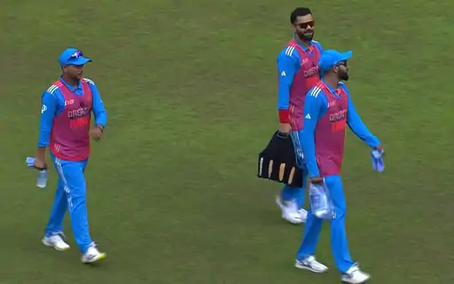 Cricket Showdown: India vs. Bangladesh 2023 - Virat Kohli's 800 Runs and More! 3 kohli carrying drinks 1694772995